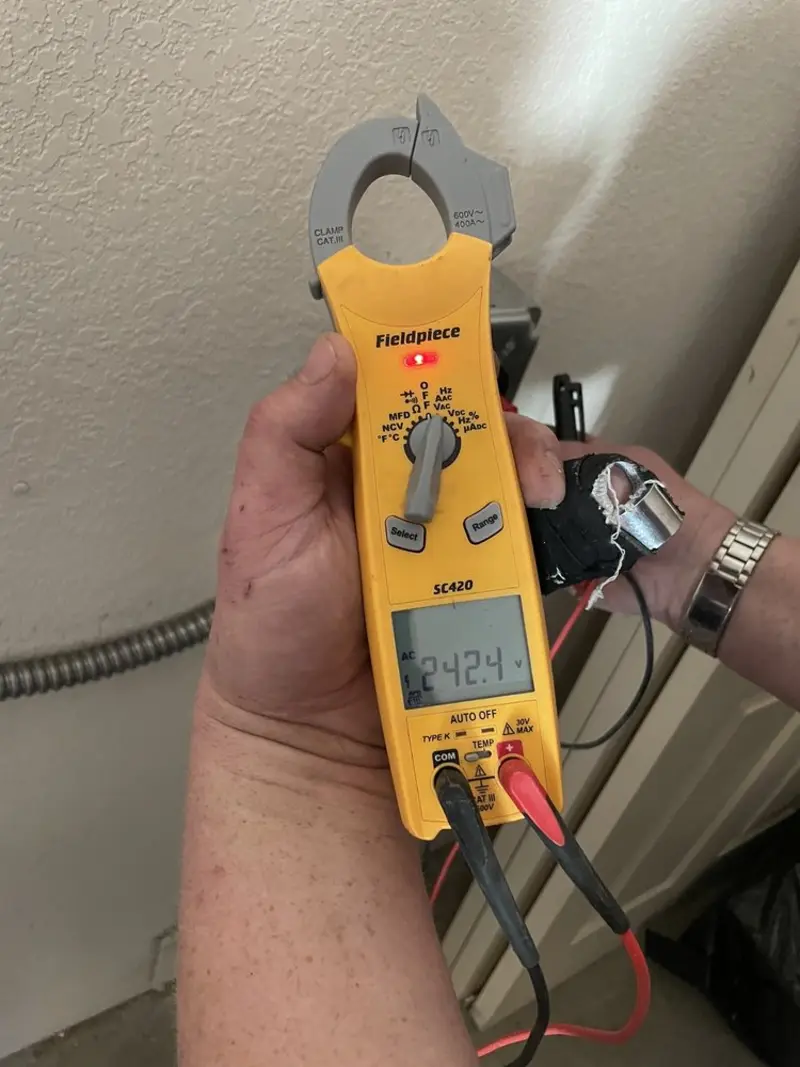 Voltage testing with clamp meter during Generator Installation in Brownwood